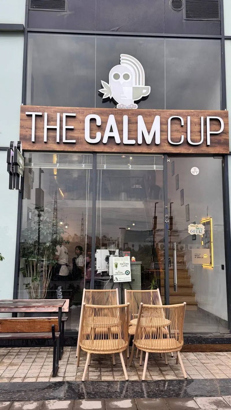 The Calm Cup storefront with its outdoor chairs